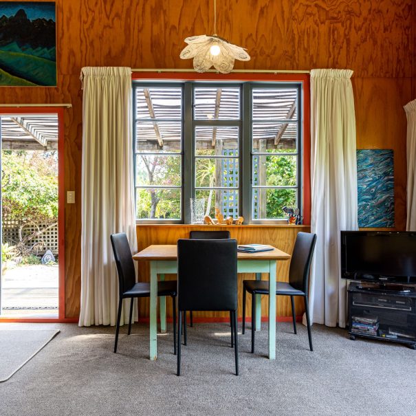 The sun pours in. Deck and garden - and 7 acres - outside